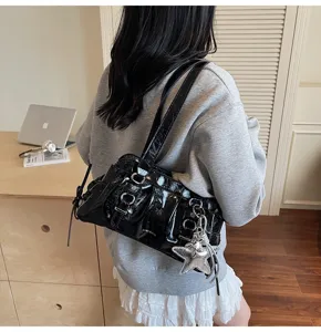 Black retro pleated shoulder underarm bag for women, soft leather casual handbag with metal details.