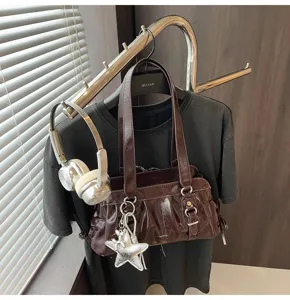 Retro brown crinkled patent leather shoulder bag for women, chic underarm bag with star pendant.