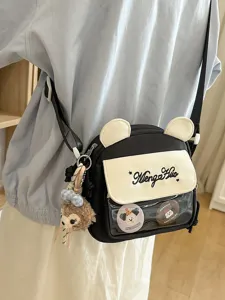 Joli sac bandoulière noir style japonais avec oreilles d'ours, poche transparente et peluche.