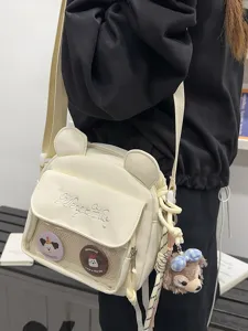Sac bandoulière toile oreilles d'ours ita bag avec poche filet et badges pour filles.