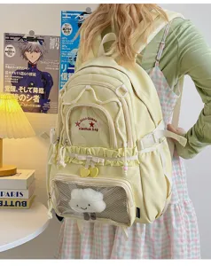 Cute Japanese style canvas backpack with cloud pendant, large capacity school bag for girls.