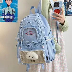 Cute Japanese style blue backpack for women, large capacity student school bag with clear pocket.