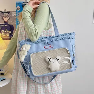 Cute Japanese style blue canvas ita bag with clear window, frills and cute plush pendant.