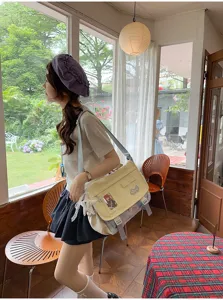 Japanese style ins canvas messenger bag with large capacity, cute aesthetic for student school use.