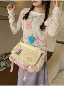 Detailed view of Japanese style canvas messenger bag, cute aesthetic crossbody bag for students.