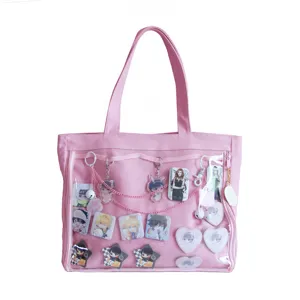 Pink canvas ita bag with clear window front pocket, cute anime pin display shoulder bag.