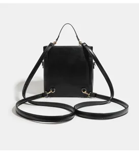 Black multi-functional PU leather backpack handbag with metal hardware for daily commute.