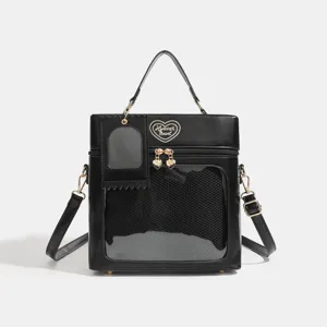 Black PU leather box pain bag with clear display window, heart embroidery, and strap.