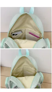 Vue intérieure du sac à dos ita vert menthe, montrant de grands compartiments et une fenêtre.