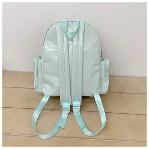 Vue arrière détaillée du sac à dos décontracté vert menthe avec bretelles réglables.