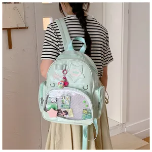 Sac à dos Ita coréen vert clair avec poche avant transparente et grande capacité.