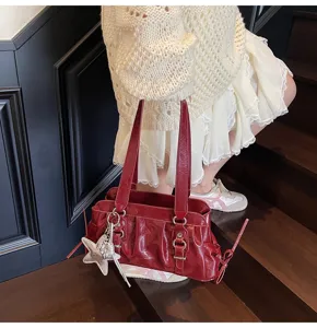 Wine red patent leather pleated shoulder bag detail, stylish Y2K underarm purse with star charm.