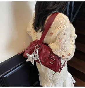Red patent leather shoulder bag for women, retro pleated underarm bag with star charm.