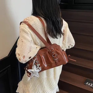 Brown patent leather pleated shoulder bag for women, vintage armpit bag with cute charms.