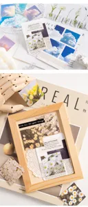 Close-up of aesthetic square memo stickers featuring nature scenery and floral designs for scrapbooking.