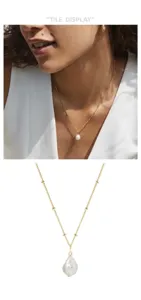 Baroque freshwater pearl pendant necklace featuring dainty gold beaded chain and natural styling.