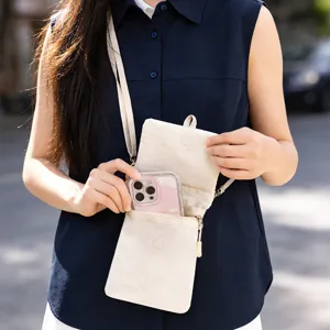 Beige crossbody passport bag travel organizer, multi-layer portable shoulder bag for trip.