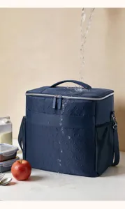Waterproof insulated lunch bag with shoulder strap, stylish dark blue cooler bag.