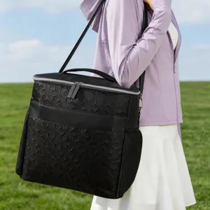 Black insulated cooler lunch bag with geometric embossed pattern and convenient shoulder strap.