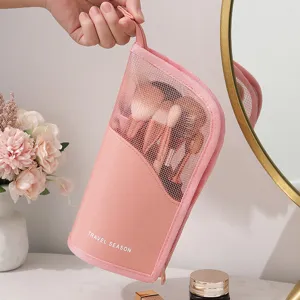 Pink travel cosmetic bag portable makeup brush organizer with mesh window and handle.