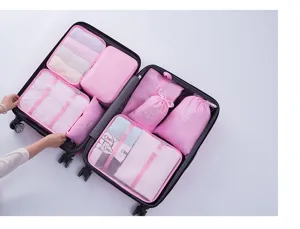 Set de 11 bolsas de viaje organizadores de maleta rosa cubos de embalaje ropa y zapatos.