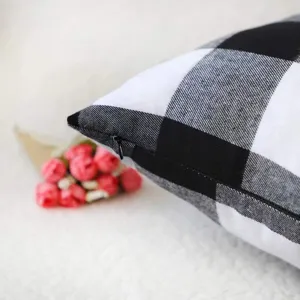 Black and white buffalo plaid throw pillow cover detail showcasing zipper and fabric texture