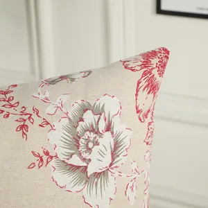 European vintage floral throw pillow cover detail, beige cotton linen with red peony pattern.