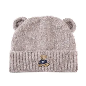 Cute bear ear knitted beanie detail, warm fluffy winter hat with cute embroidered bear design.