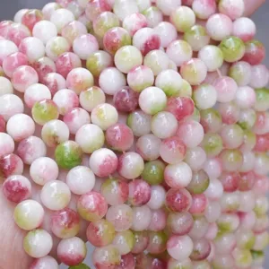 Detailed close-up shot of multicolored natural stone optimized loose round beads for DIY jewelry.