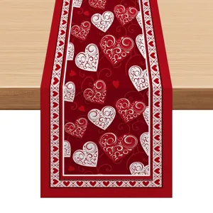 Valentine's Day table runner with elegant red and white heart patterns for festive home decor.