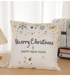 Detail shot of white gold stamping Christmas cushion cover with snowflake and festive text.