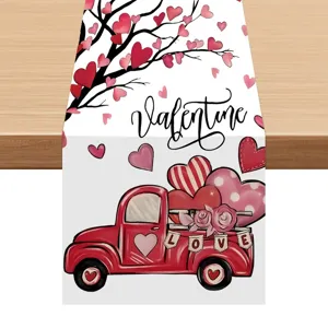Valentine red truck table runner detail showing festive heart tree print on linen fabric.
