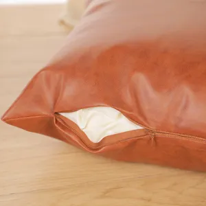 Brown faux leather throw pillow case, stylish decorative sofa cushion cover for home and office.