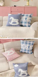 Cozy plaid throw pillow with cute rocking horse pattern and text, soft sofa cushion for home.