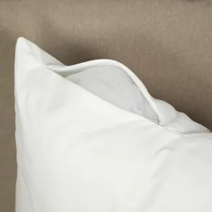 Close-up detail of white plush decorative pillowcase zipper opening, showing soft interior.