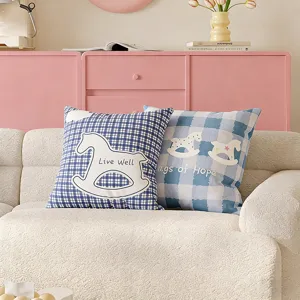 Cozy blue checkered throw pillow with cute rocking horse pattern for living room sofa decor.