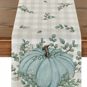 Camino de mesa de Acción de Gracias de otoño con calabaza azul y hojas de eucalipto.
