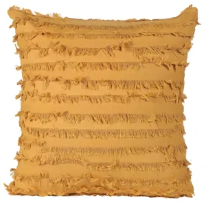 Close-up detail of the bohemian style yellow cotton throw pillow with layered fringe design.