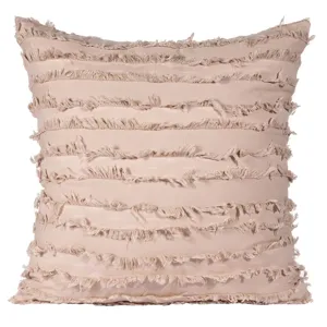 Bohemian style striped fringed pillow cover detail showing textured fabric and layers.