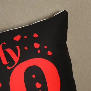 Black red heart cushion cover detail shot, soft fabric home decor sofa pillow case.