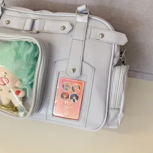 PU leather ita bag Japanese style clear window shoulder bag detail view with anime card