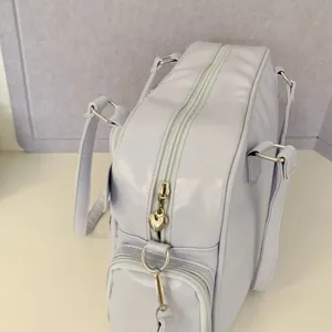 Japanese style light purple tote bag, casual multi-pocket design, ideal for student commuting.