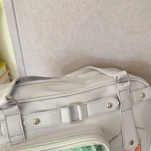 Detailed view of a light purple Japanese style student ita bag featuring a clear window.