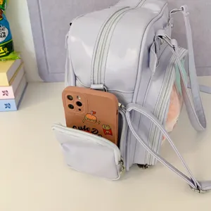 Detail view of the light purple ita bag with multi-pockets and clear window for daily use.