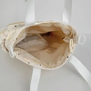 Interior detail view of the cute star polka dot ita bag showing lining and storage pockets.