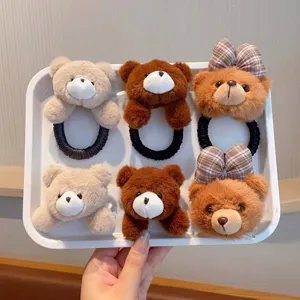 Plush bear hair ties with cute cartoon design and plaid bows, soft autumn and winter accessories.
