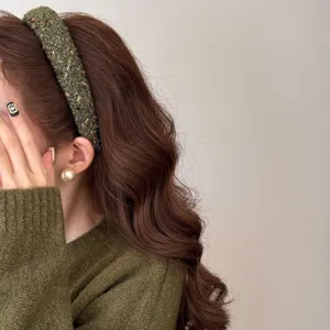 Green tweed knitted headband detail shot, autumn winter vintage wide hair hoop accessory.