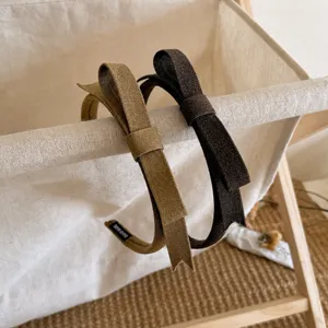 Retro stoffen strik haarband set in kaki en donkerbruin, schattig en elegant haaraccessoire.