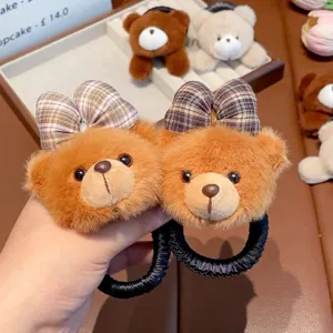 Cute plush bear hair ties for kids, featuring soft plaid bows for lovely daily hairstyles.