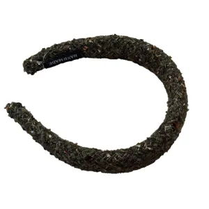 Retro dark green tweed headband for women, thick knitted hair hoop with subtle shimmer details.